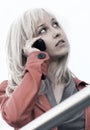 Young fashion blond business woman talking on cell phone outdoor Royalty Free Stock Photo