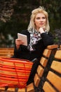 Young fashion blond business woman using digital tablet computer Royalty Free Stock Photo