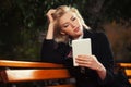 Young fashion blond business woman using digital tablet computer Royalty Free Stock Photo