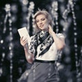 Young fashion blond business woman using digital tablet computer Royalty Free Stock Photo