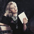 Young fashion blond business woman using digital tablet computer Royalty Free Stock Photo