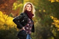 Young fashion blond woman in leather jacket in autumn park Royalty Free Stock Photo