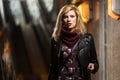 Young fashion blond woman in leather jacket