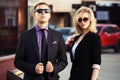 Young fashion business couple on the city street Royalty Free Stock Photo