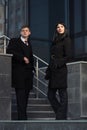 Young fashion business couple on steps at office building Royalty Free Stock Photo