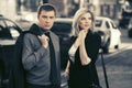 Young fashion business couple walking in city street Royalty Free Stock Photo