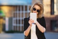 Young fashion business woman in black blazer using tablet computer Royalty Free Stock Photo