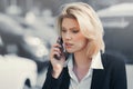 Young fashion business woman calling on cell phone in city street Royalty Free Stock Photo