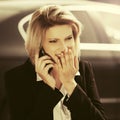 Young fashion business woman calling on cell phone on city street Royalty Free Stock Photo