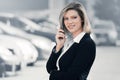 Young fashion business woman calling on cell phone in city street Royalty Free Stock Photo