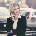 Young fashion business woman calling on cell phone on city street Royalty Free Stock Photo