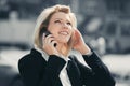 Young fashion business woman calling on cell phone in city street Royalty Free Stock Photo