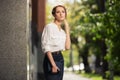 Young fashion business woman with handbag on city street Royalty Free Stock Photo