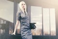 Young fashion business woman with handbag at office building Royalty Free Stock Photo