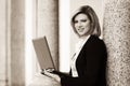 Young fashion business woman with laptop at office building Royalty Free Stock Photo