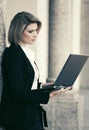 Young fashion business woman with laptop at office building Royalty Free Stock Photo