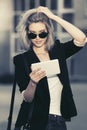 Young fashion business woman in sunglasses using digital tablet computer Royalty Free Stock Photo