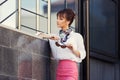 Young fashion business woman in white shirt and pink pencil skirt Royalty Free Stock Photo