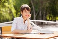 Young fashion business woman working at sidewalk cafe Royalty Free Stock Photo