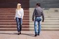 Young fashion couple flirting on city street