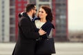 Young fashion couple in love walking on city street Royalty Free Stock Photo