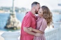 Young fashion couple of lovers at beginning of love story - Handsome man whispers kisses in pretty woman ear - Royalty Free Stock Photo