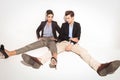 Young fashion couple relaxing on studio background Royalty Free Stock Photo