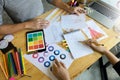 young fashion designer work on the table with tailor tool