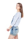 Young fashion girl in jeans overalls posing isolated Royalty Free Stock Photo