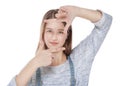 Young fashion girl looking through hands frame isolated