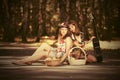 Young fashion girls with fruit baskets in summer forest Royalty Free Stock Photo