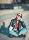 Young fashion hipster beautiful girl in leather jacke with retro