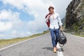 Young fashion man comes down the road Royalty Free Stock Photo