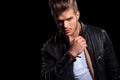 Young fashion man in leather jacket thinking Royalty Free Stock Photo