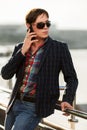 Young fashion man in sunglasses calling on phone Royalty Free Stock Photo