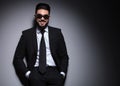 Young fashion man with sunglasses smiles at you Royalty Free Stock Photo