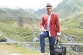 Young fashion man with voyage bag outdoor