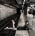 Young fashion model posing in NYC Subway.