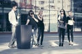 Young fashion people talking on cell phones in city street Royalty Free Stock Photo