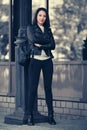 Young fashion woman in black leather jacket and skinny jeans Royalty Free Stock Photo