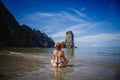 Young fashion woman relax on the beach. Happy island lifestyle. White sand, blue cloudy sky and crystal sea of tropical beach. Royalty Free Stock Photo