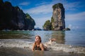 Young fashion woman relax on the beach. Happy island lifestyle. White sand, blue cloudy sky and crystal sea of tropical beach. Royalty Free Stock Photo