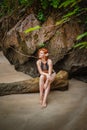 Young fashion woman relax on the beach. Happy island lifestyle. White sand, blue cloudy sky and crystal sea of tropical beach. Royalty Free Stock Photo