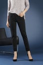 Young fashion woman`s legs in jeans Royalty Free Stock Photo