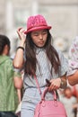 Young fashionable Chinese girl with a pink hat, Beijing, China