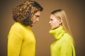 Young fashionable couple. Fashion photo of elegant couple in Studio. Couple portrait on yellow background. Royalty Free Stock Photo