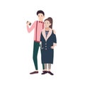 Young fashionable couple of man and woman dressed in stylish clothes embracing and making selfie on smartphone. Concept