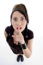Young fashionable female shushing Royalty Free Stock Photo