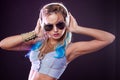 Young fashionable girl in disco style. Listening music and enjoying. Royalty Free Stock Photo