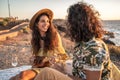 Young fashionable hippie couple on a romantic picnic on the beach Royalty Free Stock Photo